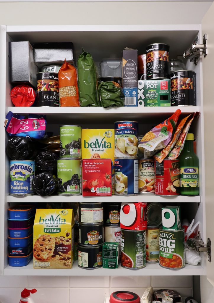 cupboard full of packets of food